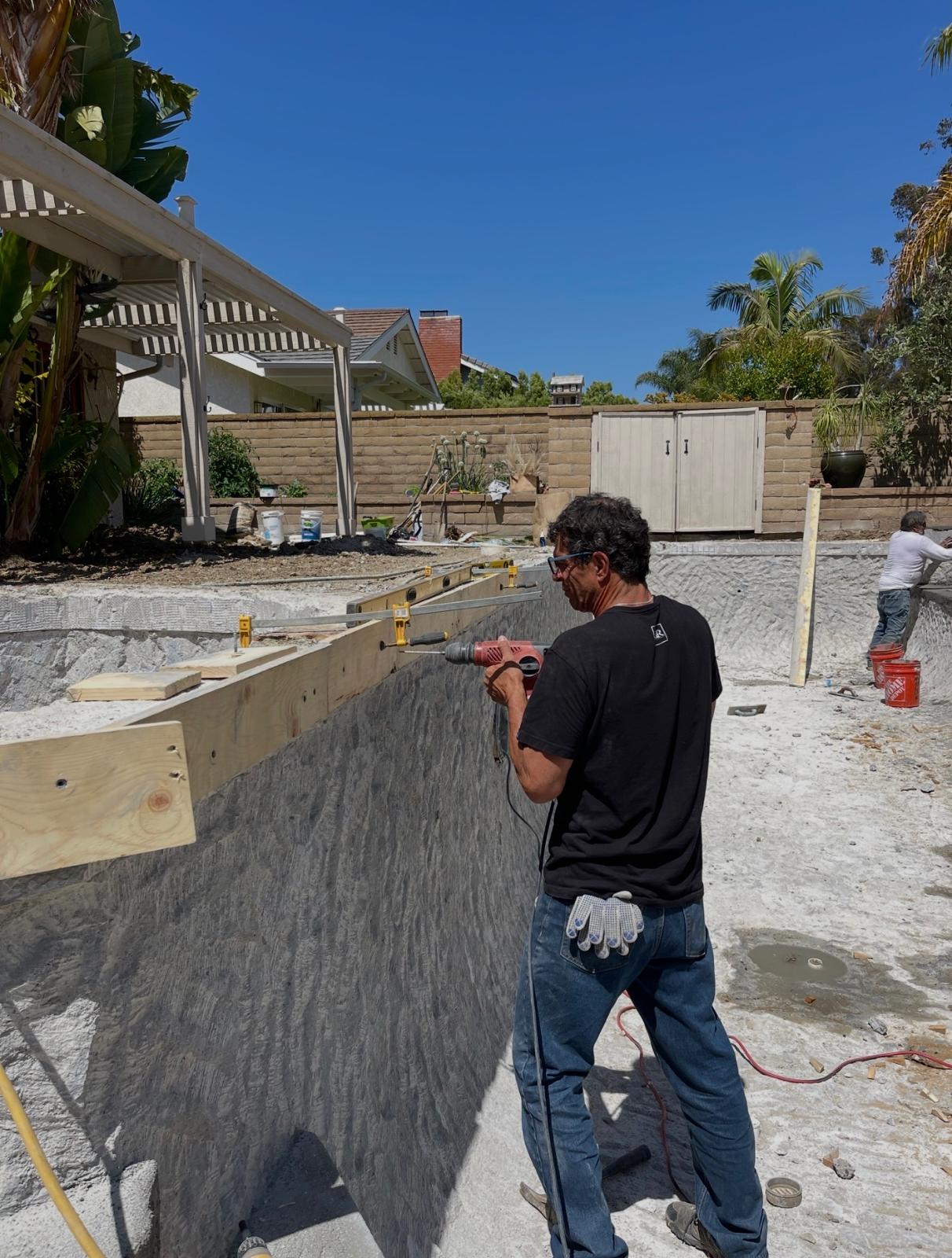 Hands-on construction of the new pool edge