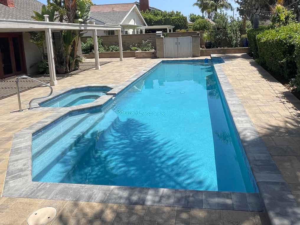 Completed McFarlane swimming pool and spa with clear blue water